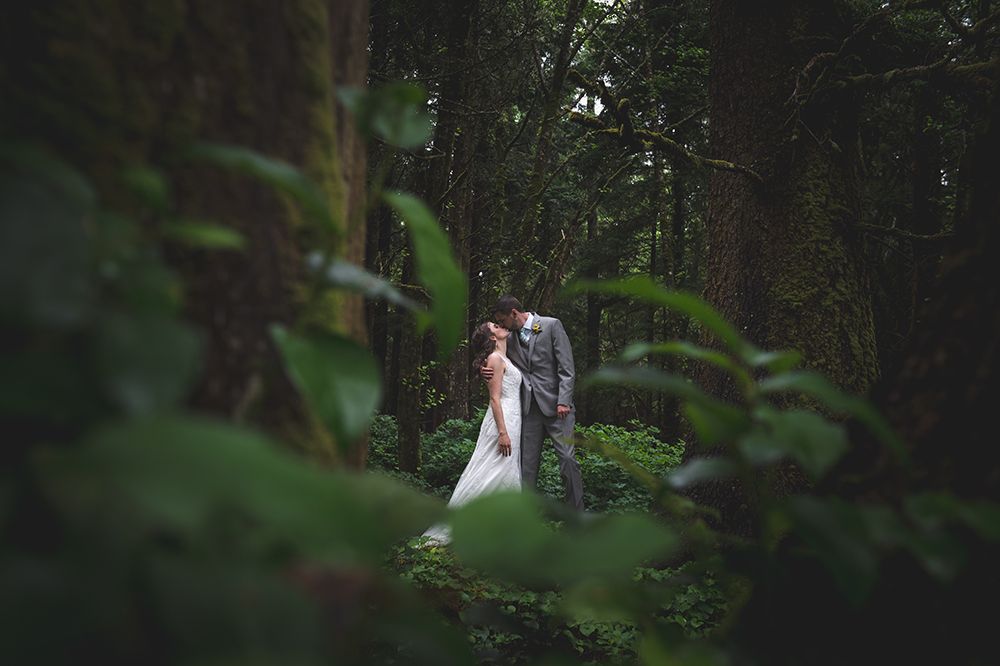 Romantic forest wedding photography with natural greenery and soft lighting.