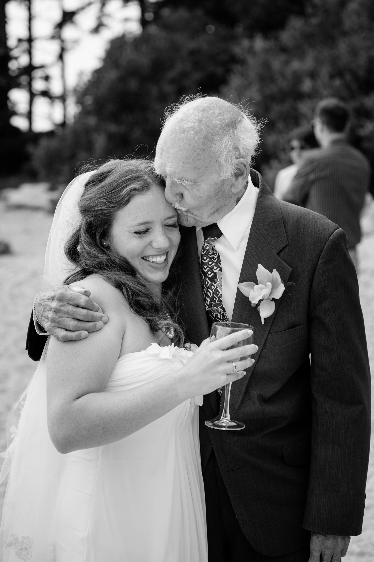 Black and white series of emotional wedding moments outdoors.