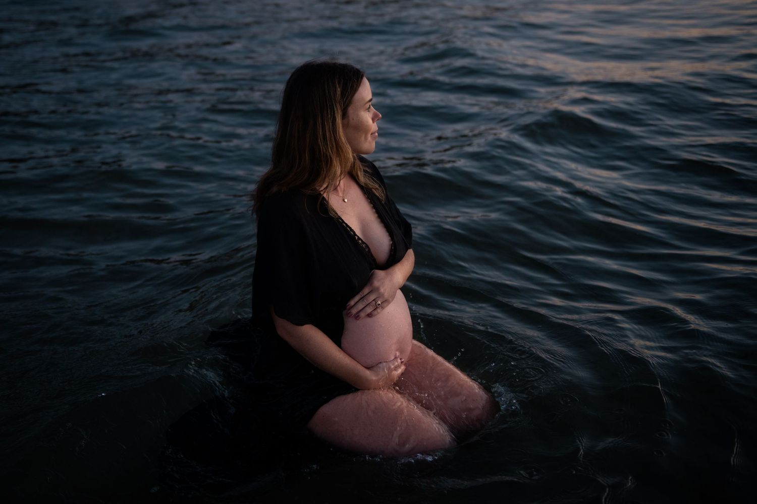 Artistic water portrait with rippling waves during blue hour.