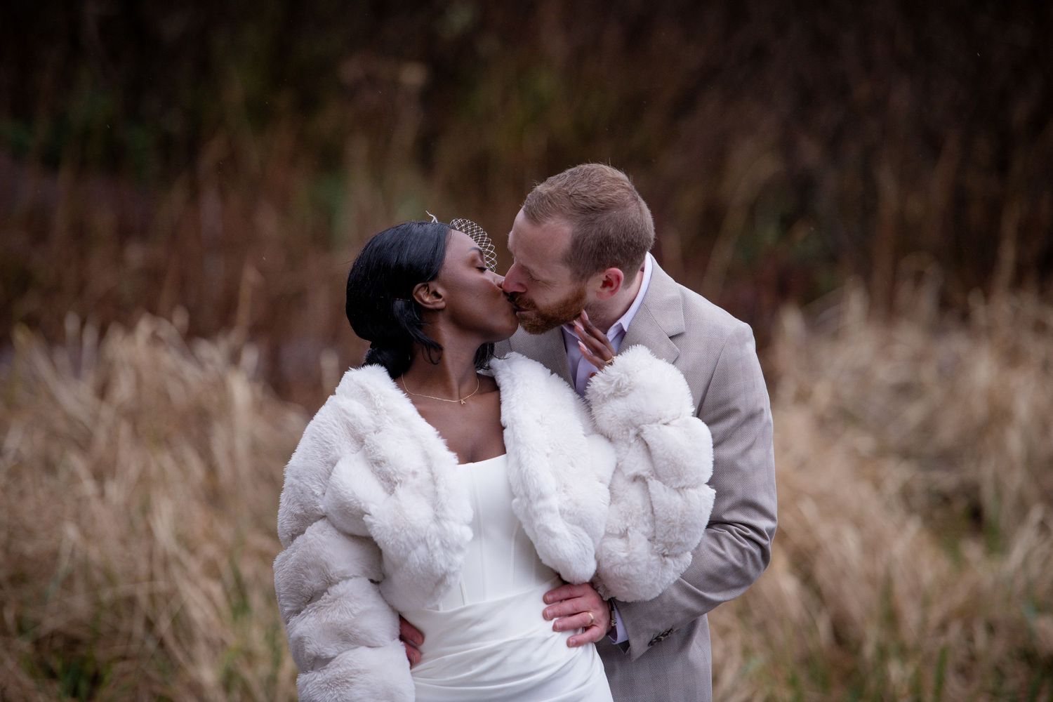 A romantic couple embraces in multiple candid moments against a blurred outdoor background.