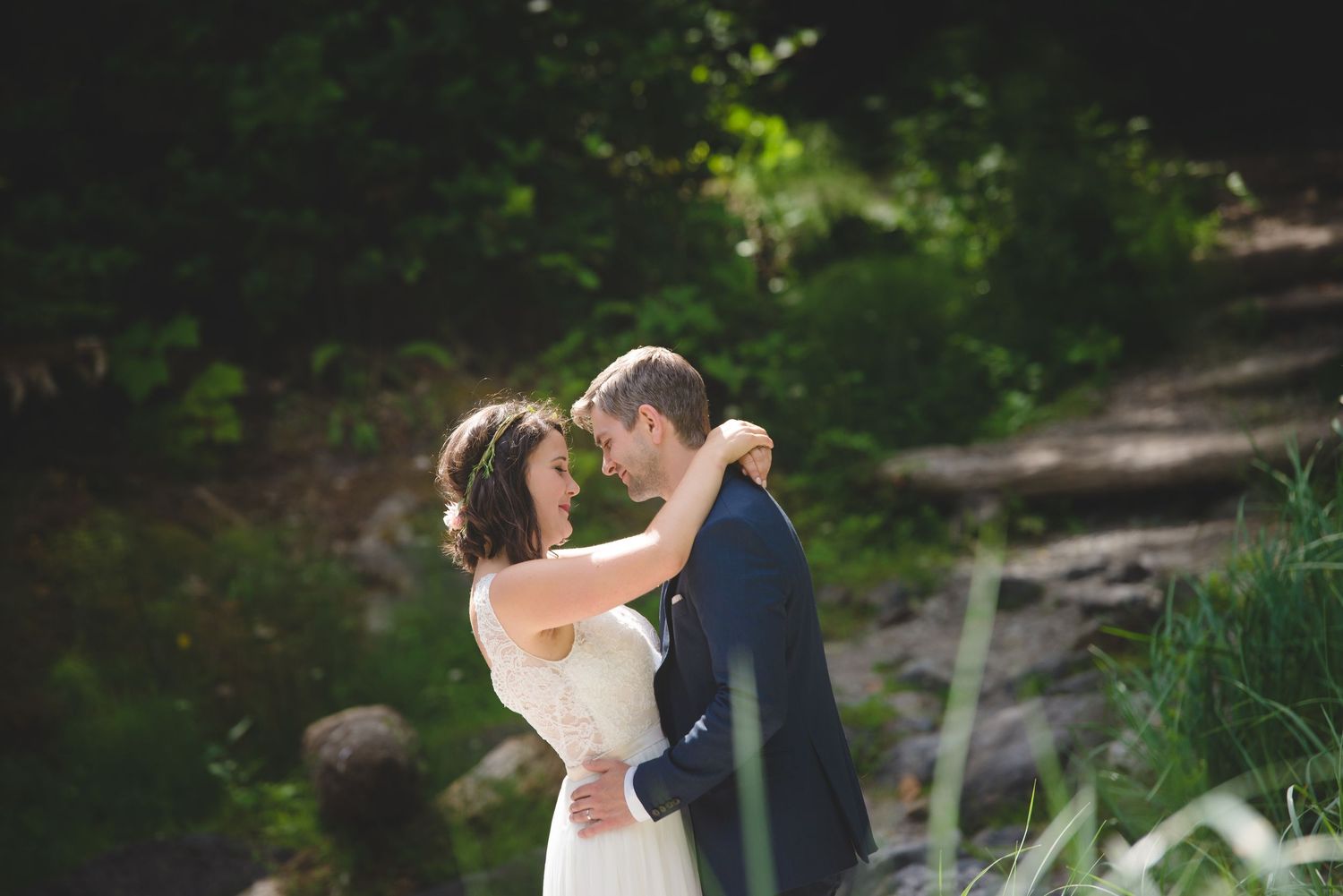 Romantic dance sequence in natural outdoor garden setting.