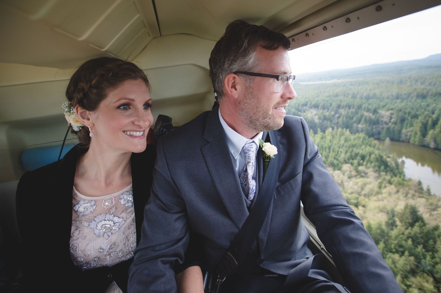 Scenic mountain landscape viewed through helicopter windows during a wedding flight.