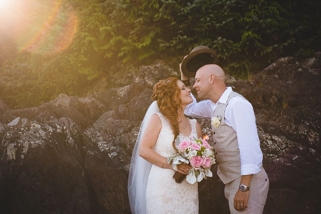 Romantic sunset wedding portraits with couples embracing in golden light.