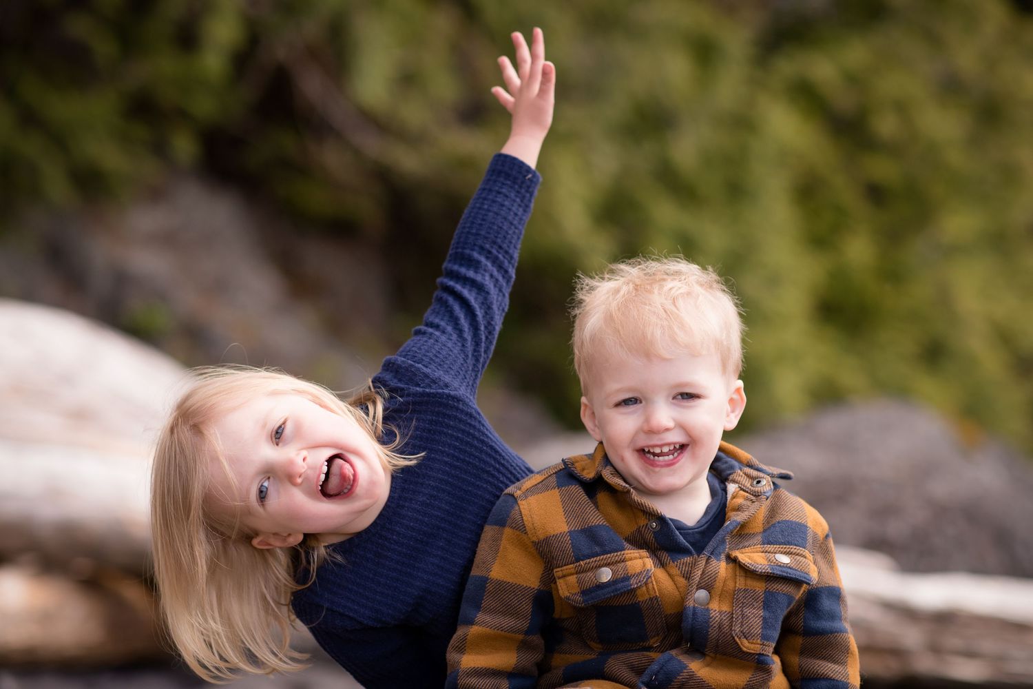 A joyful family plays and laughs together in a series of candid outdoor moments.