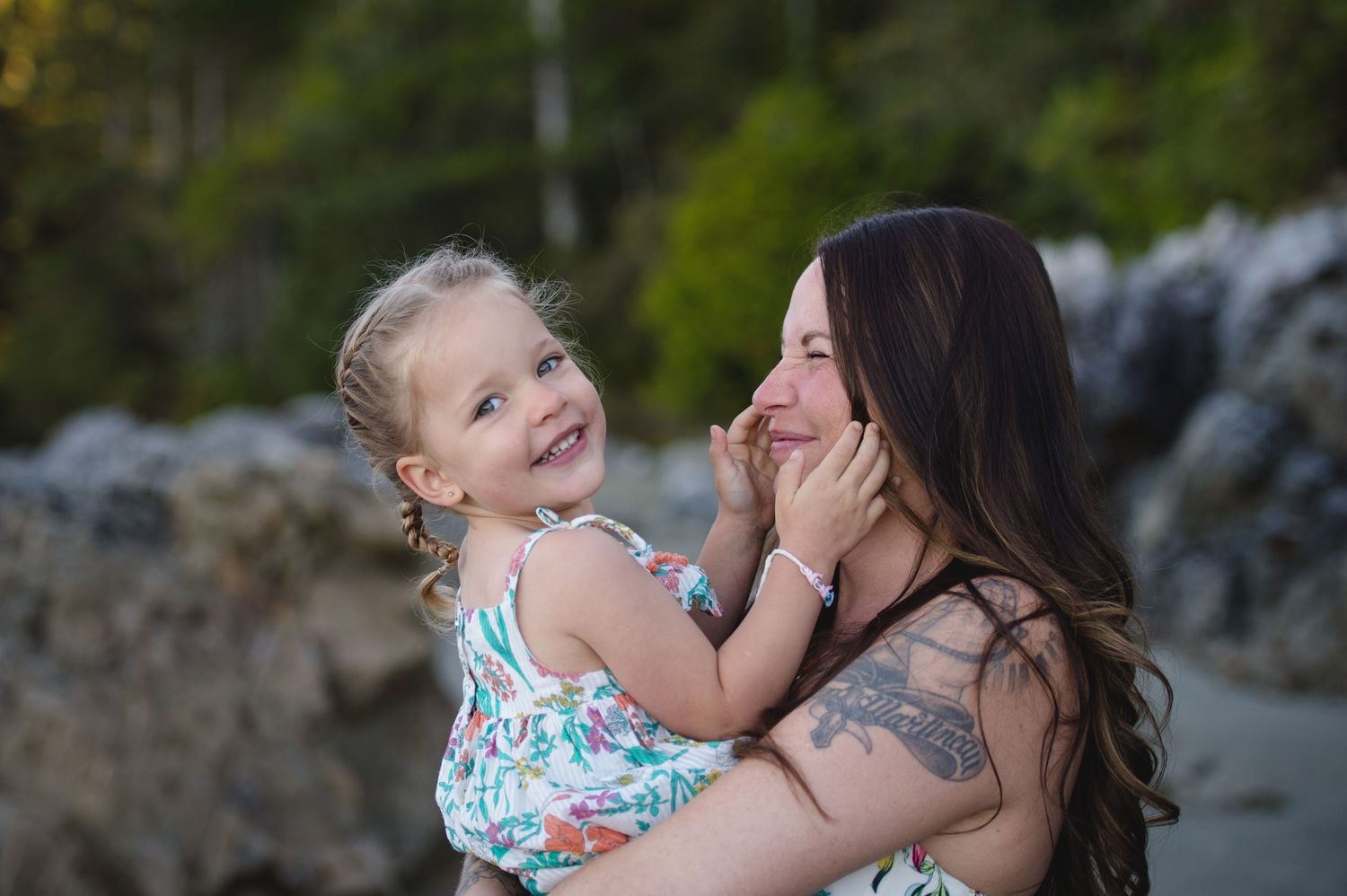 Natural outdoor family photography session with joyful expressions and embraces.