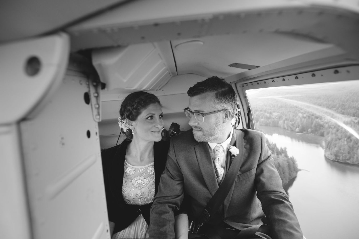 A couple exchanges vows inside a small aircraft during their wedding ceremony.