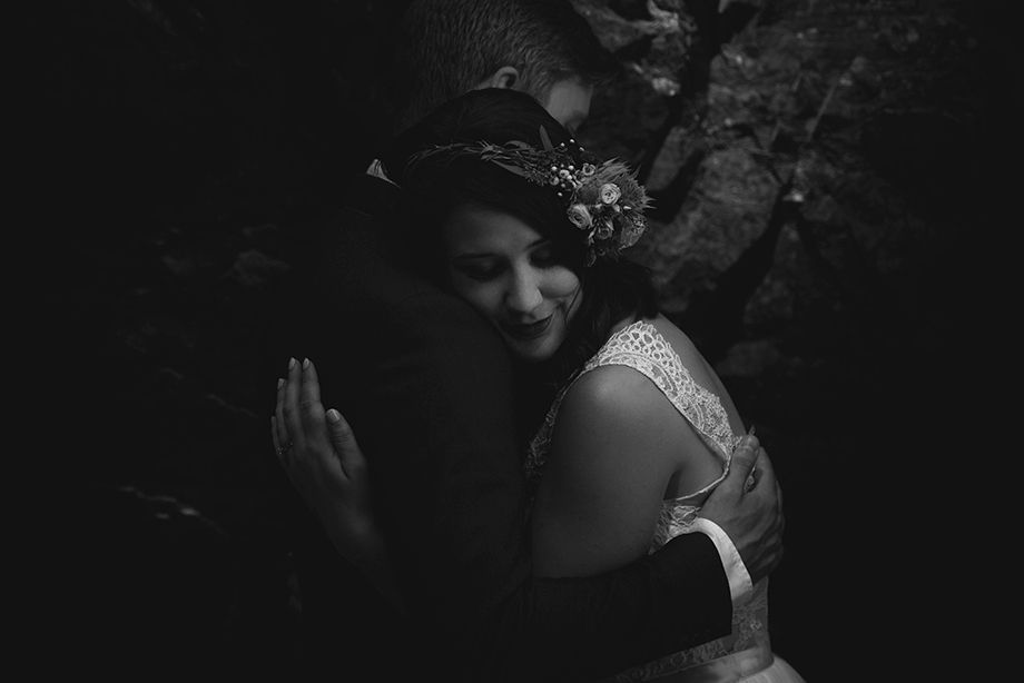 Intimate black and white wedding moments captured in dramatic lighting.