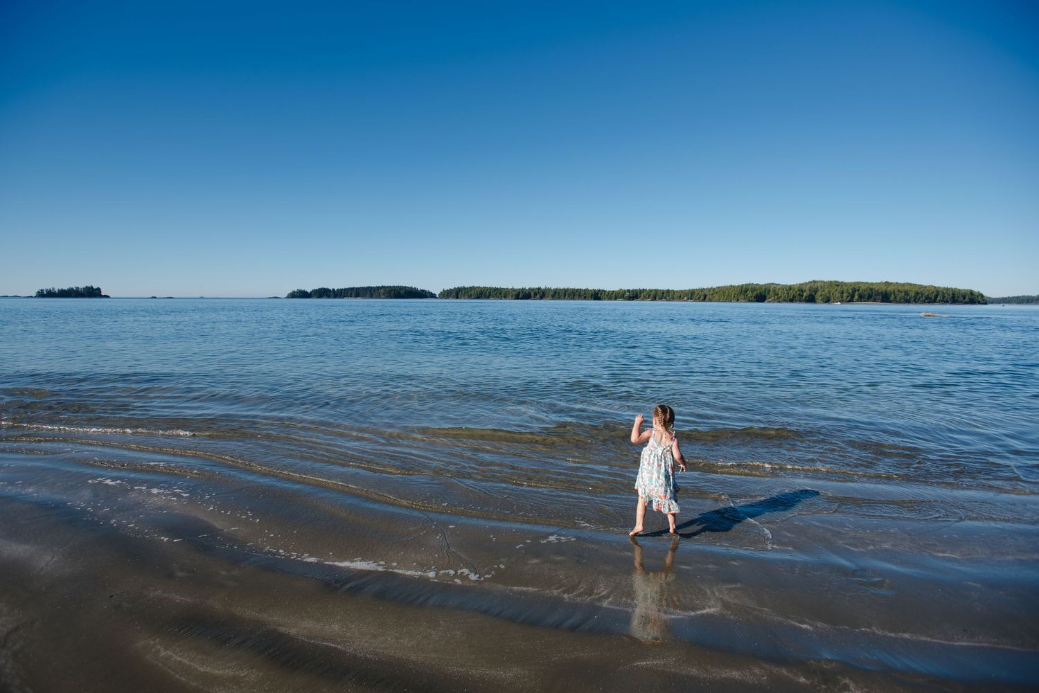 Panoramic view of calm blue ocean waters stretching to distant horizon.