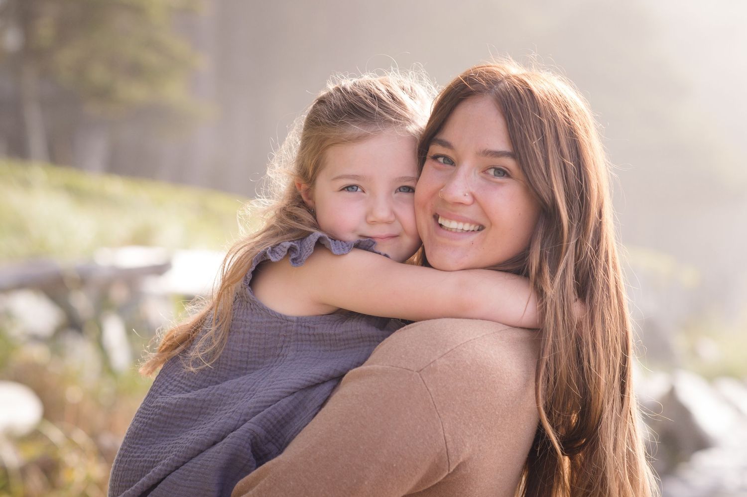 Sweet candid moments between family members during a sunset photo session.