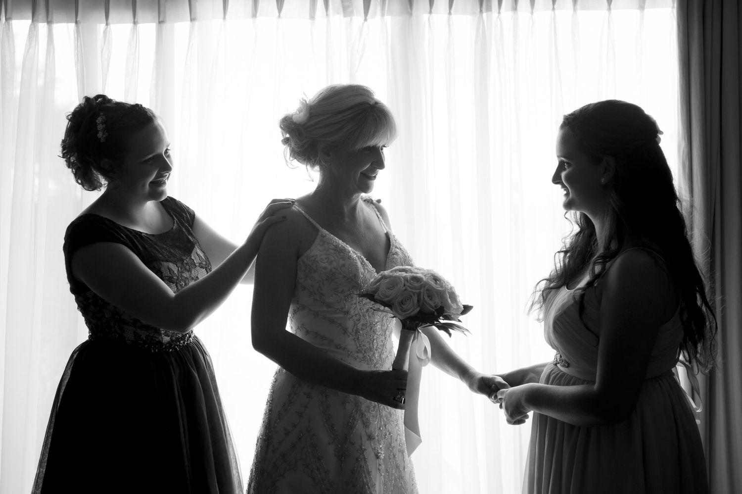 Black and white silhouettes by window during preparation moments.