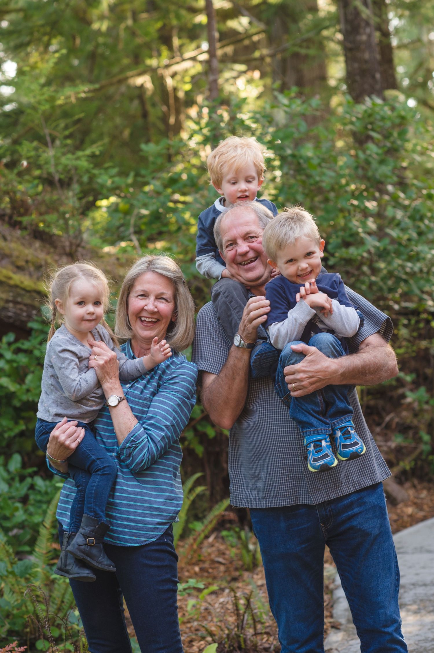 Playful outdoor family moments captured in a series of candid shots among green forest trees.