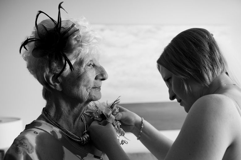 Intimate black and white portrait capturing tender moments between two people.