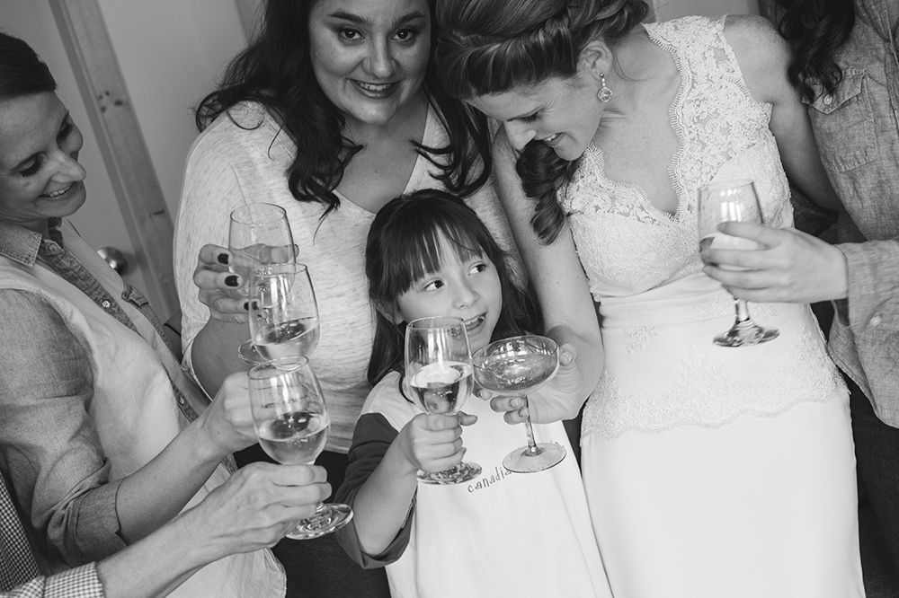 Wedding guests enjoying drinks and conversation at a reception.