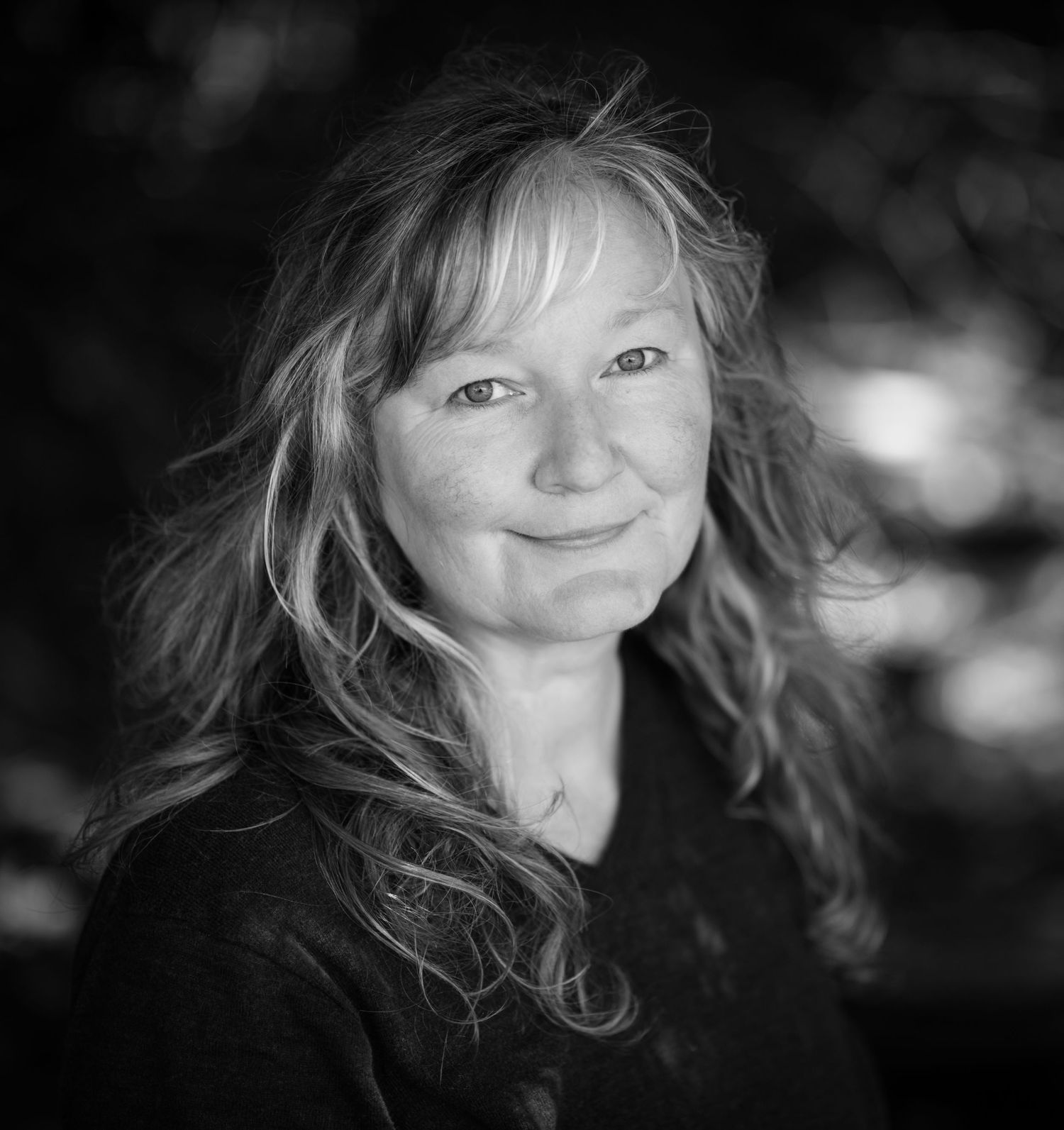 Black and white artistic portrait series with soft lighting and natural expressions.