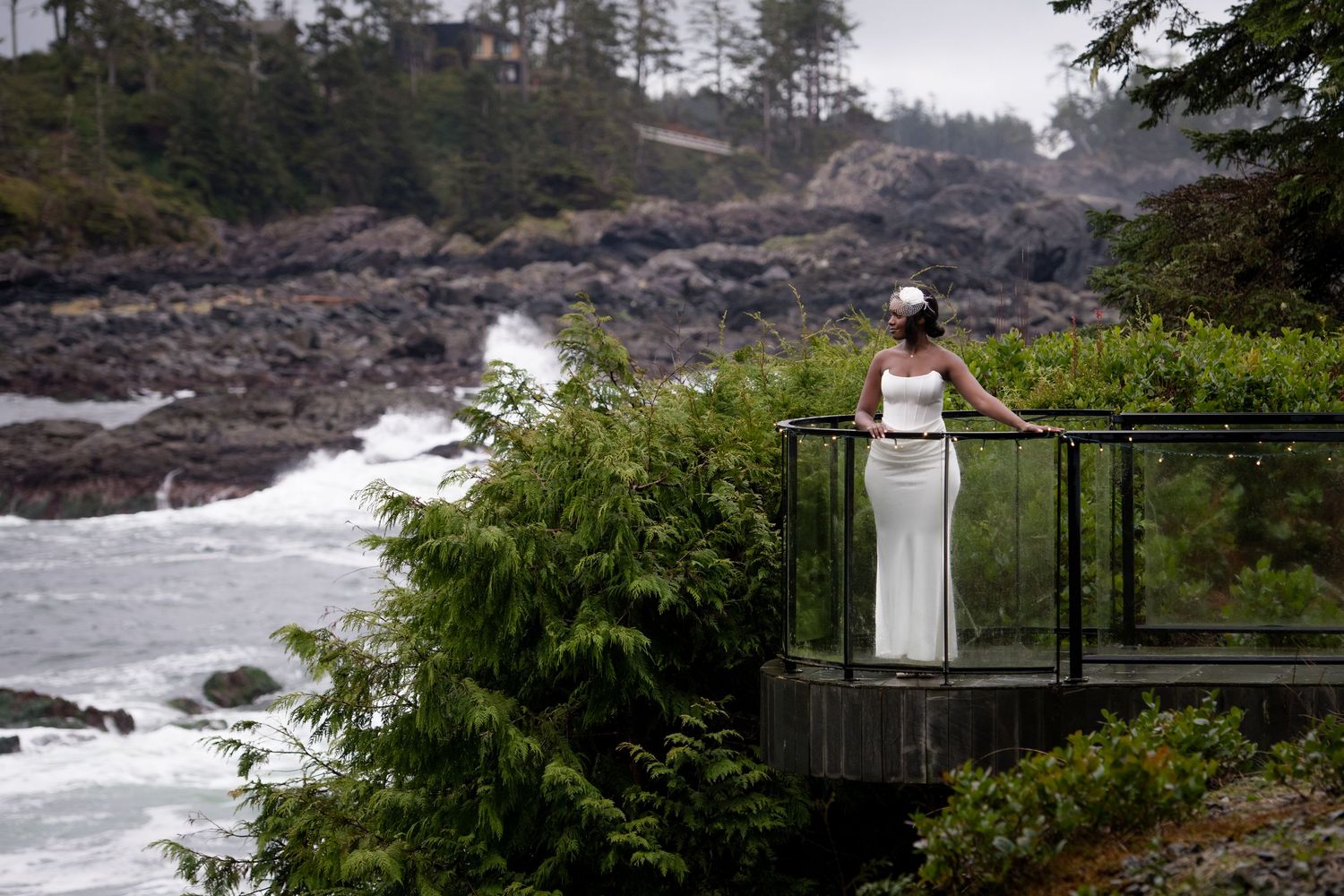 Scenic coastal viewpoint overlooking rugged cliffs and ocean waves with wooden observation deck.