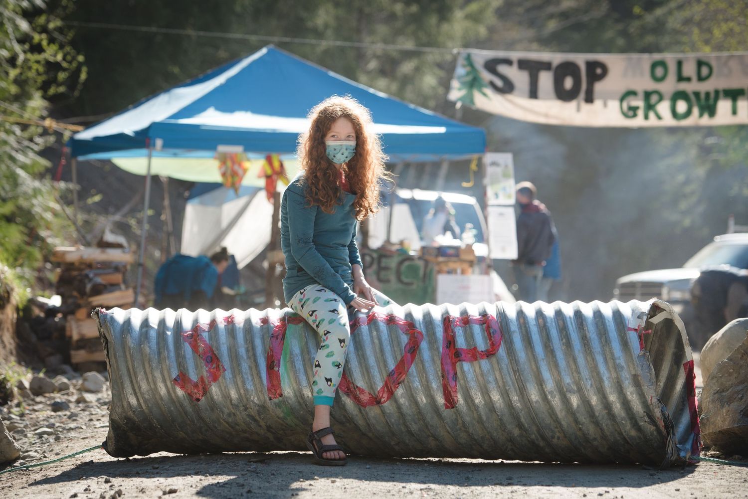 Fairy Creek protest with young girl stopping logging.
