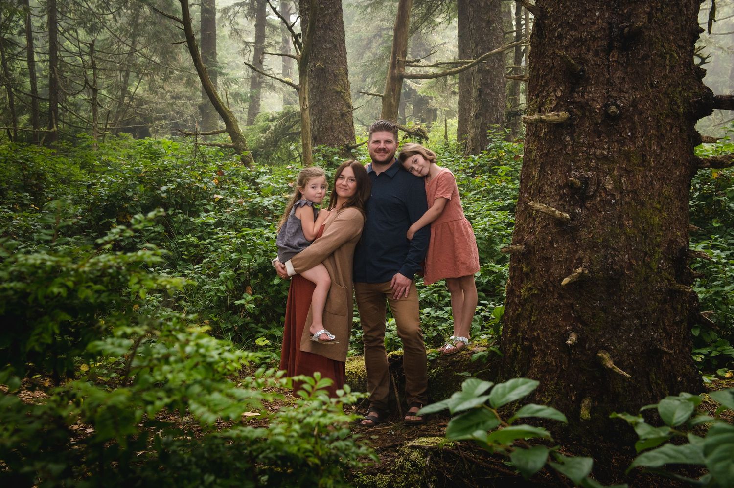 Natural light photography session in a mossy Pacific Northwest forest.