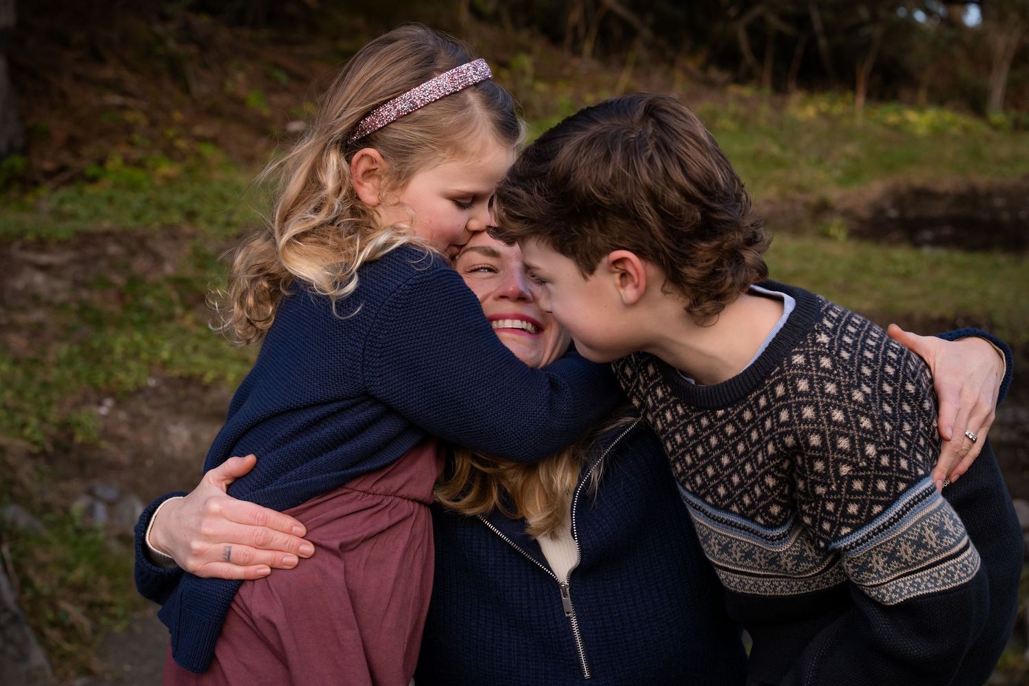 Group sharing intimate moment together outdoors in natural setting.