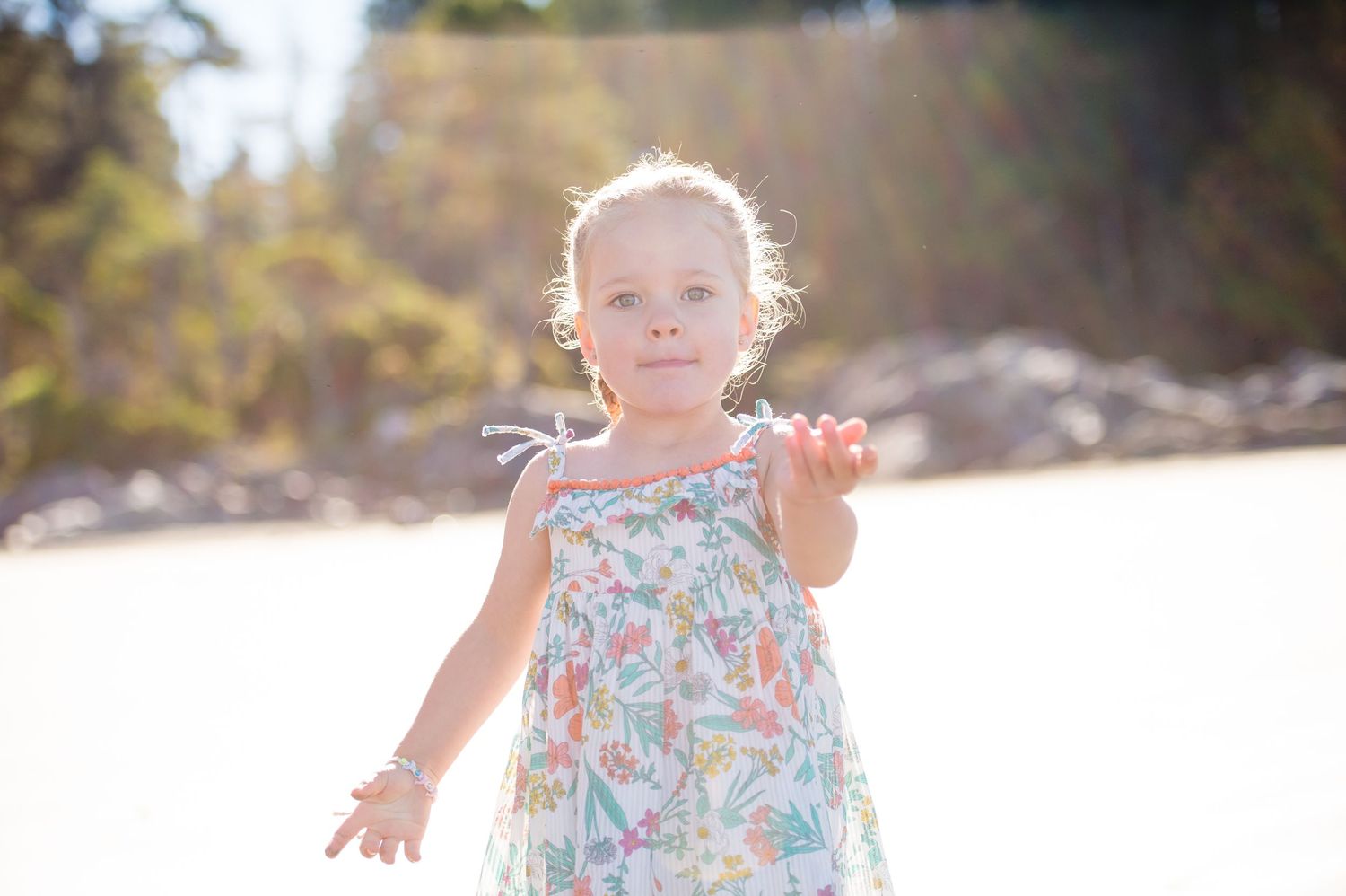 A joyful beach photoshoot sequence showing playful interactions on the sand at sunset.