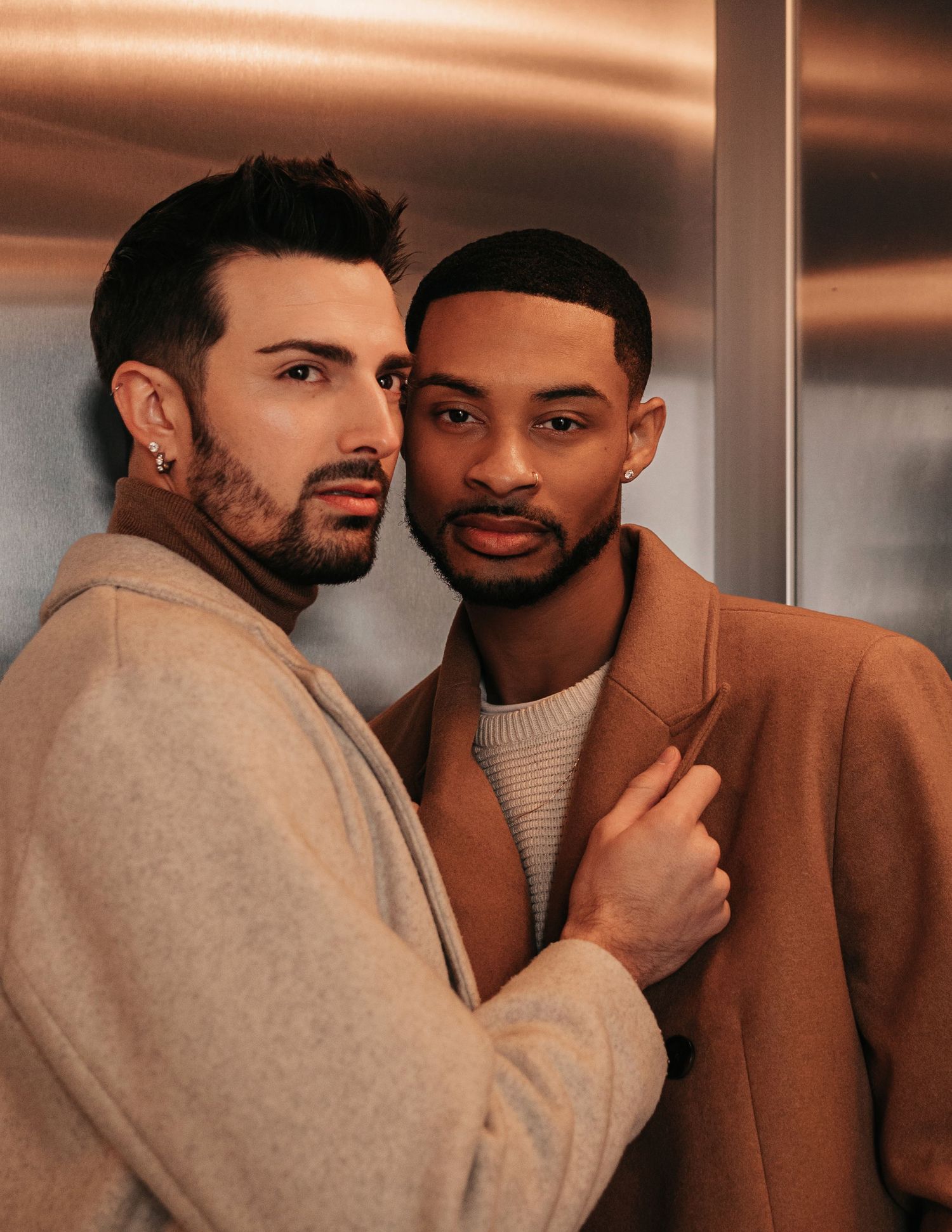 Moody cinematic elevator engagement portraits for same-sex couple in Huntsville