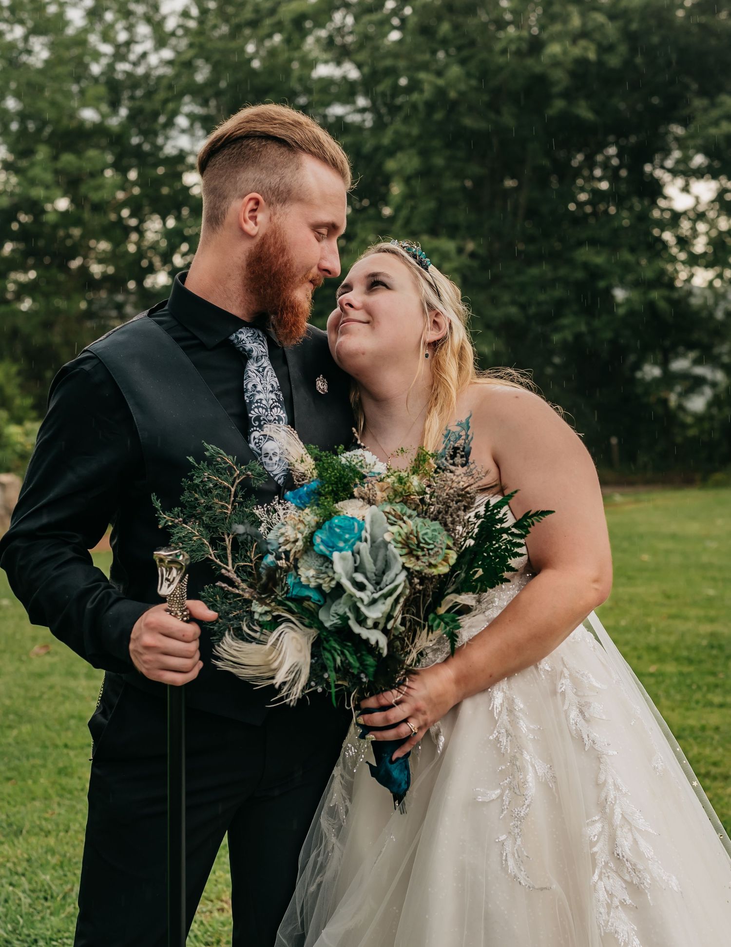 Close shot of bride and groom looking at each other lovingly with lush green trees behind them at Monte Sano Lodge in Huntsville, AL.