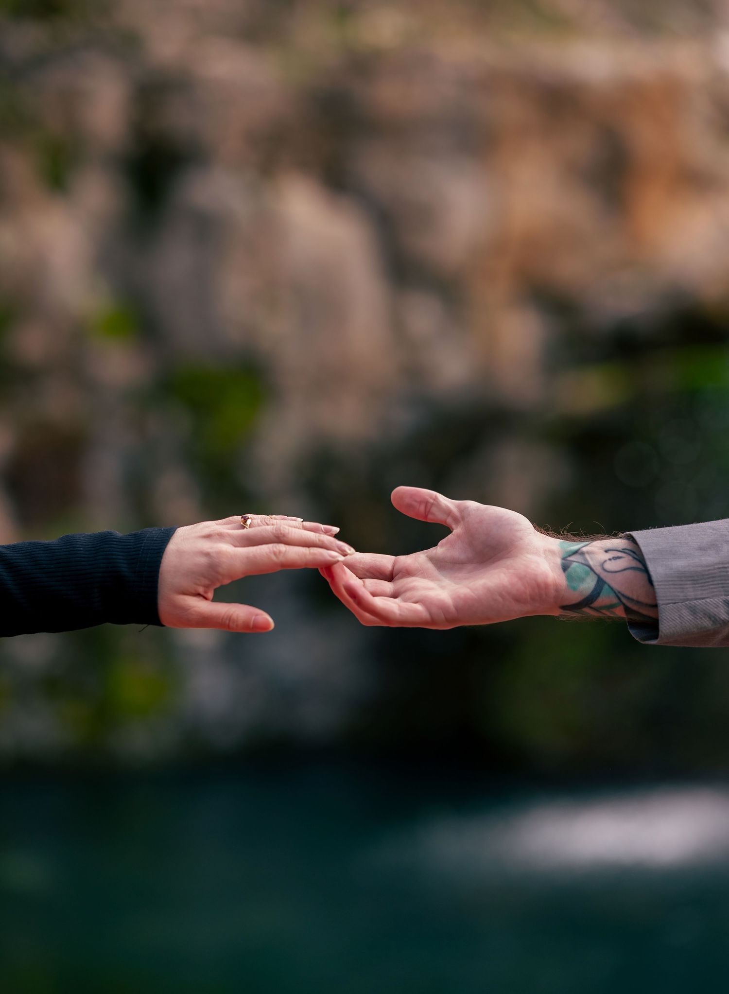 creative detail editorial image of couples hands barely touching at Big Spring Park in Huntsville, AL by Catch Your Fire Photography