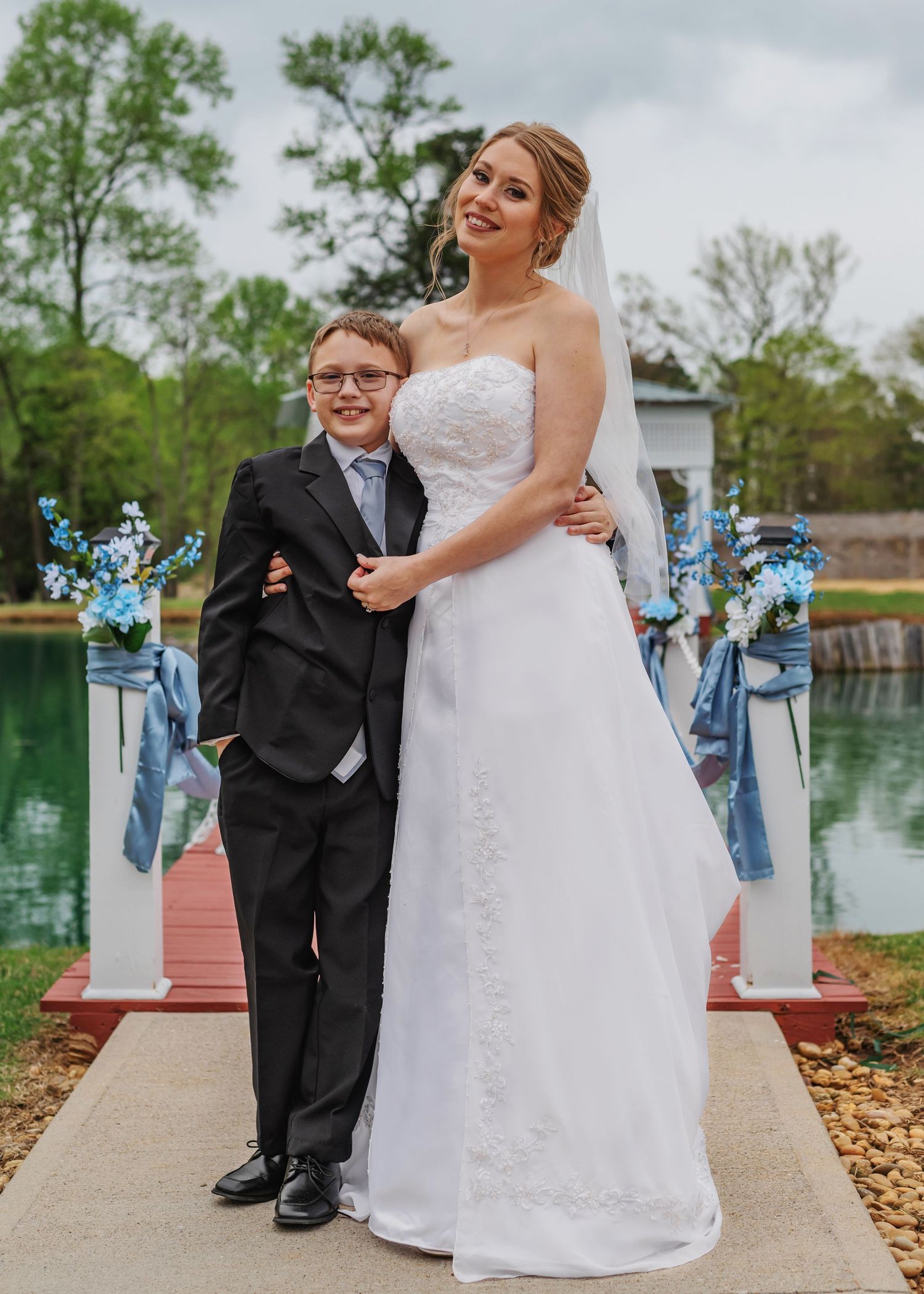 Bride with her son during wedding day at The Swan House wedding venue in New Market, Alabama photographed by Catch Your Fire Photography.