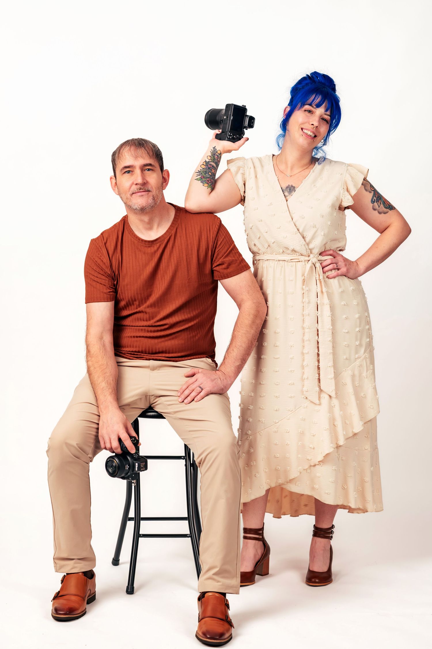 Huntsville, Alabama husband and wife wedding photography duo Carolyn and Barry of Catch Your Fire Photography in studio