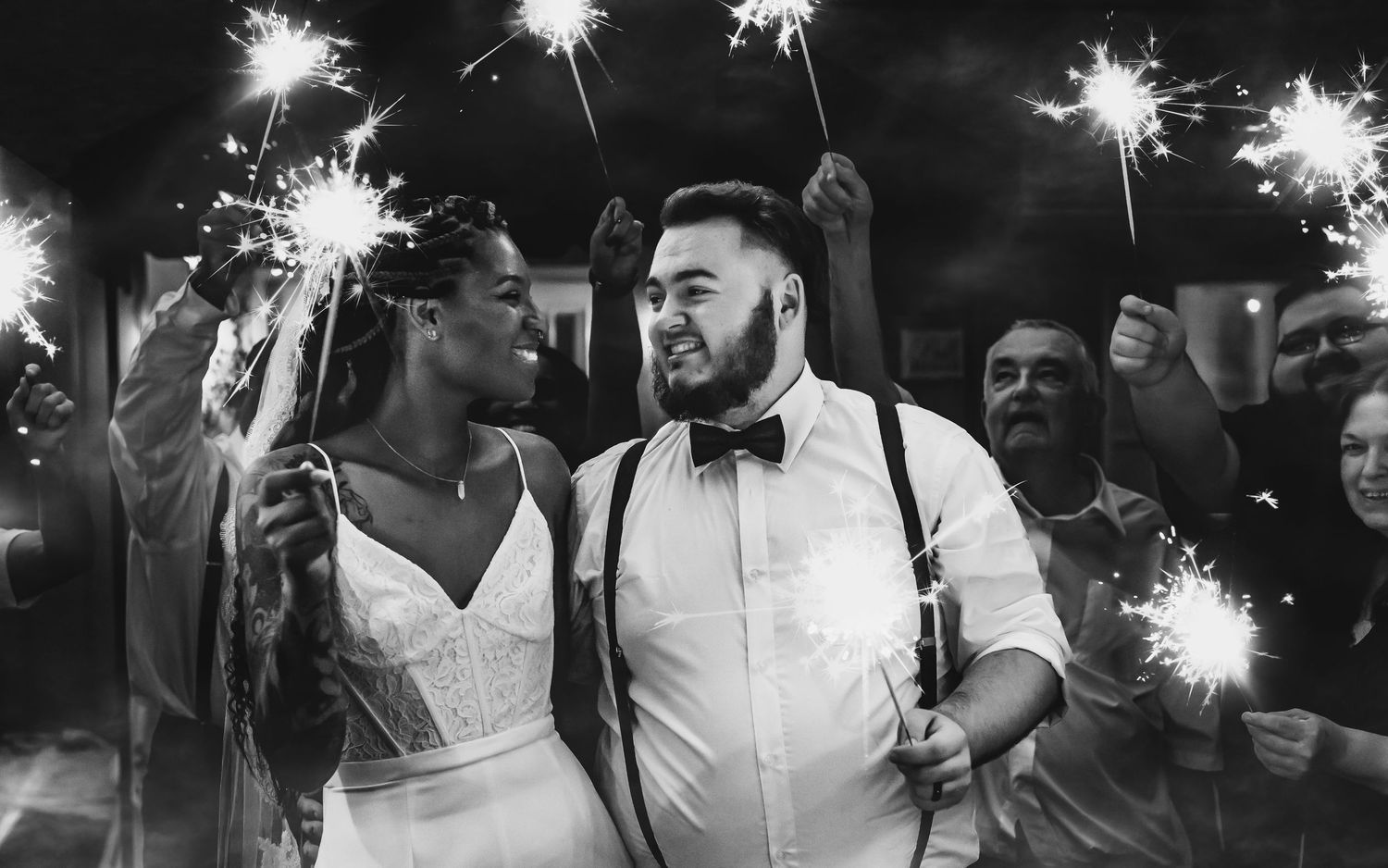 Black and white sparkler exit at wedding celebration, captured by Catch Your Fire Photography in Huntsville