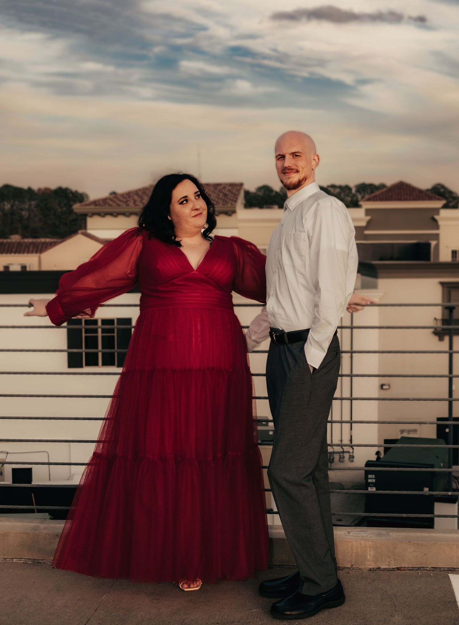 Luxury, editorial, moody rooftop engagement portrait at Bridge Street in Huntsville, AL, captured by Catch Your Fire Photography