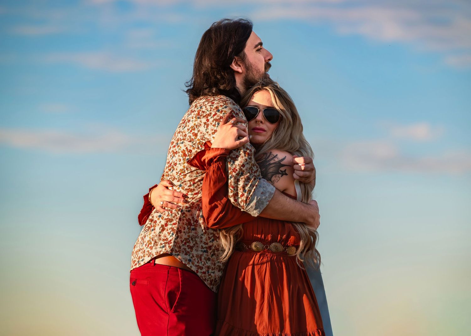 Candid Tate Farms engagement portrait shot from below, couple relaxed under bright sky, bride in sunglasses, captured by Catch Your Fire