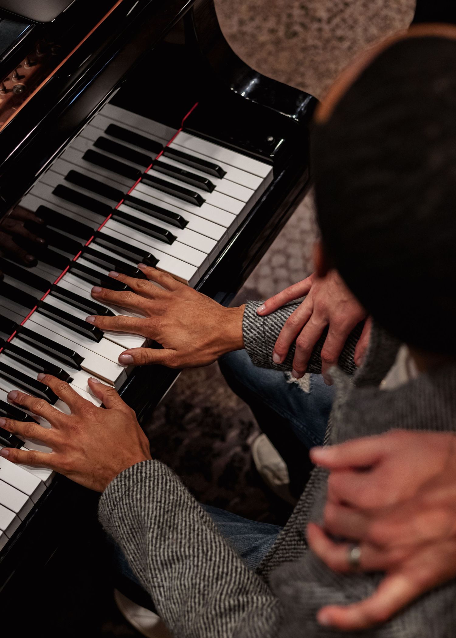 Romantic piano engagement portraits for LGBTQ+ couple at The Westin hotel
