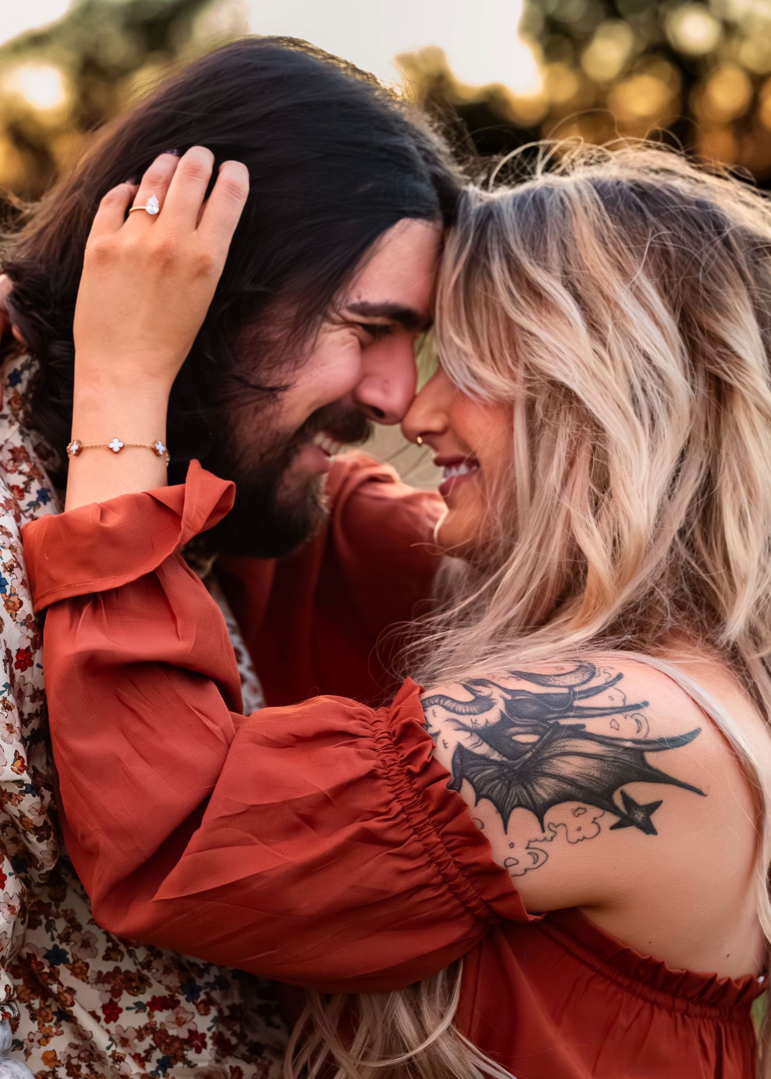 Close-up of couple touching foreheads during fall surprise proposal at Tate Farms, smiling in intimate moment, captured by Catch Your Fire