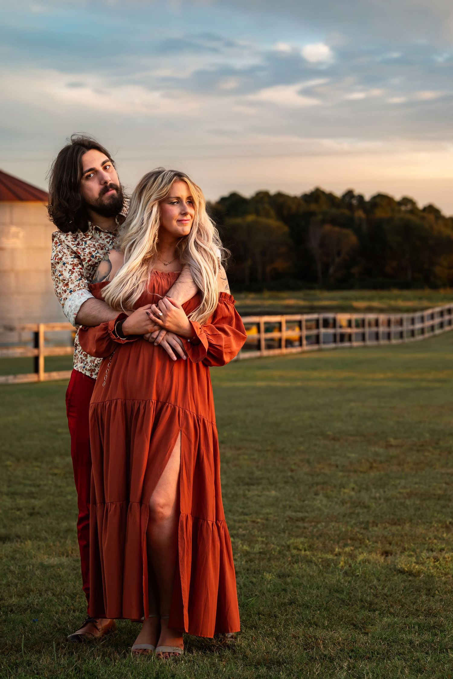 Sunset engagement portrait at Tate Farms with golden light, photographed by Carolyn Patterson of  Catch Your Fire Photography