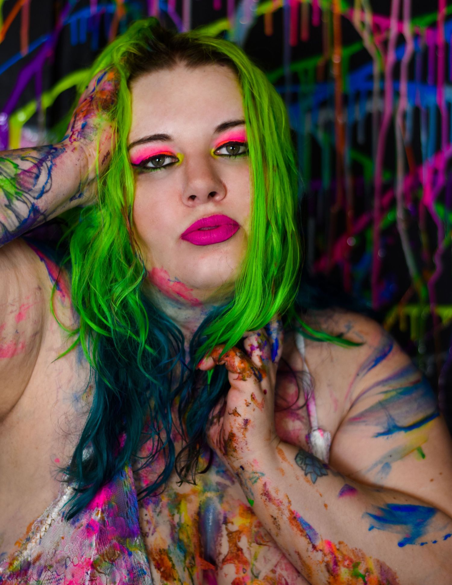 Blacklight boudoir session with neon paint in home studio, captured by Catch Your Fire Photography.