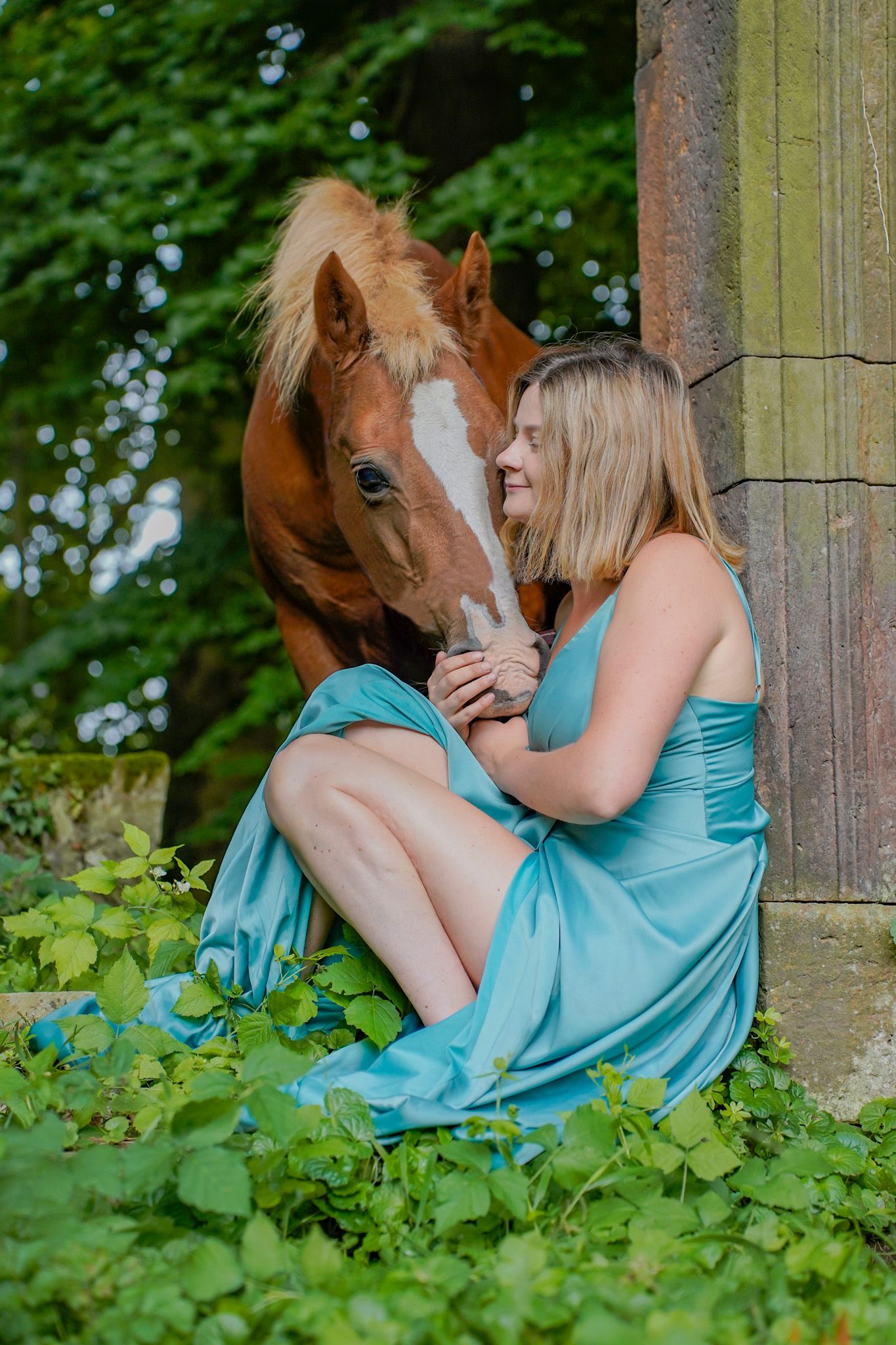 Sweet interaction between horse and companion among garden pillars.