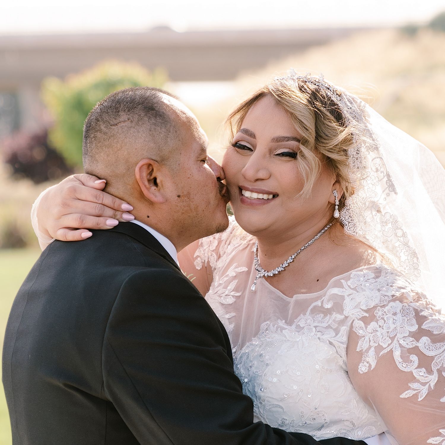 Local Merced Wedding, Happy Bride and Groom outside a church. High quality photography services. Anchor Point Images.