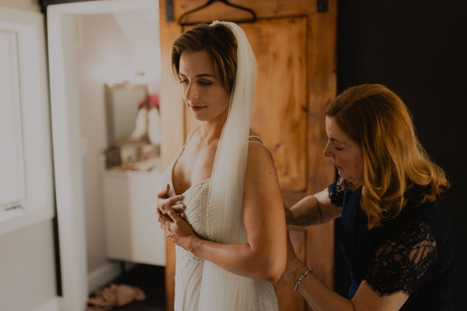 Bride and groom exchanging rings during their vows