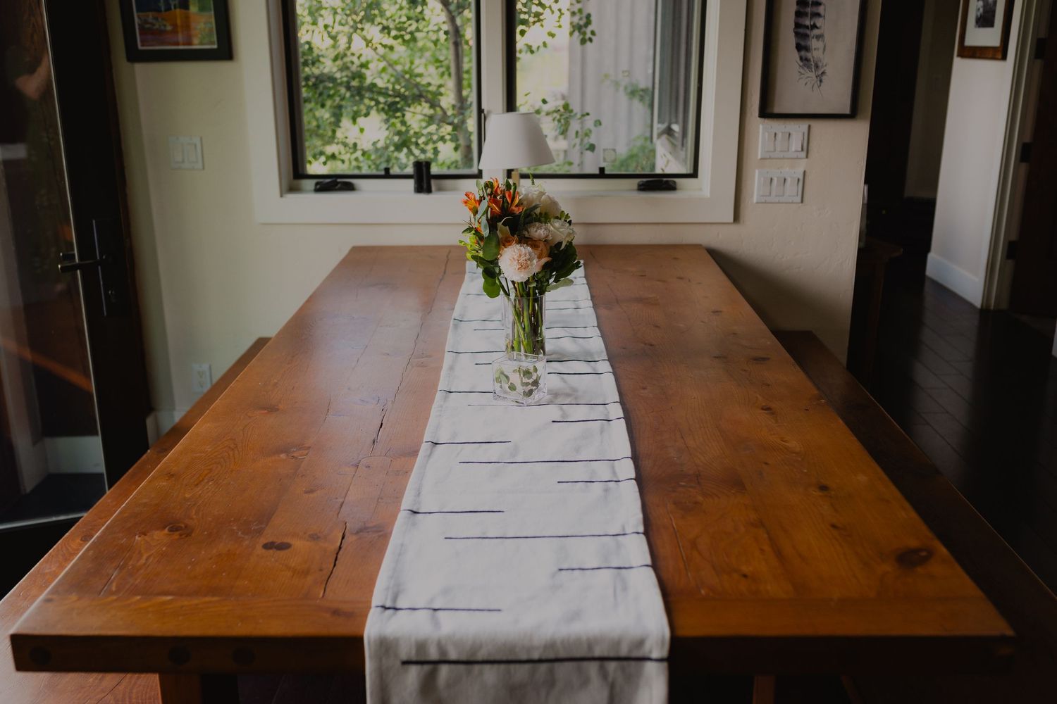 Detail shot of wedding rings on a rustic wooden table at Apache Ranch