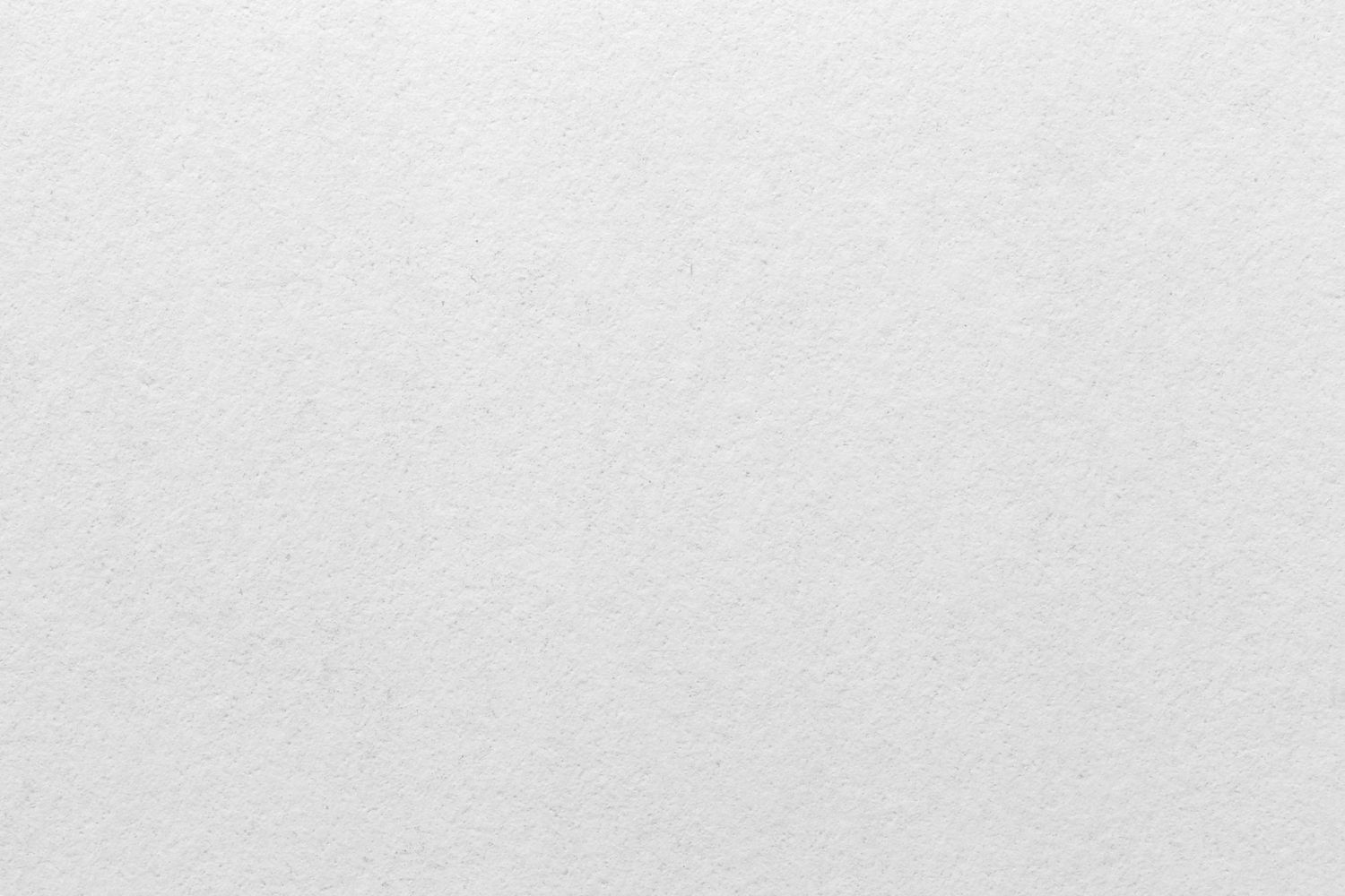 Elegant black and white close-up of decorative paper with calligraphic text elements.