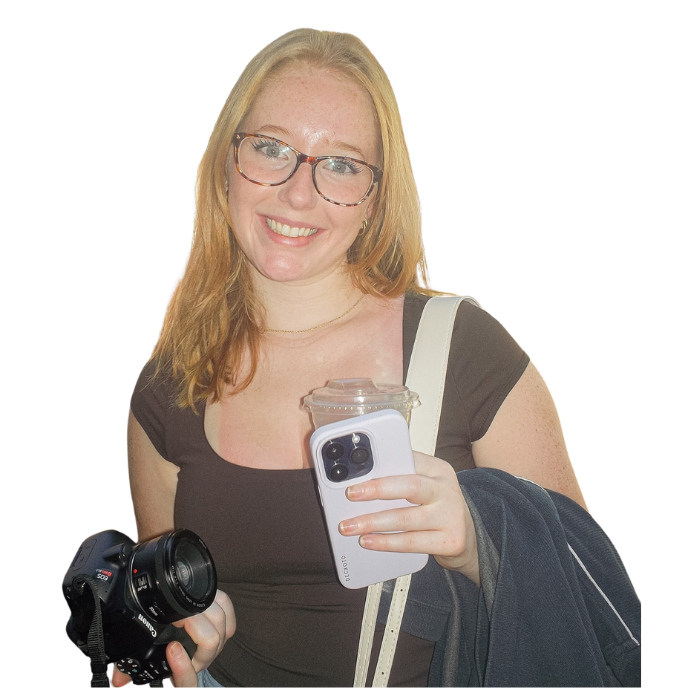 Photographer with glasses takes a series of selfies while holding camera equipment.