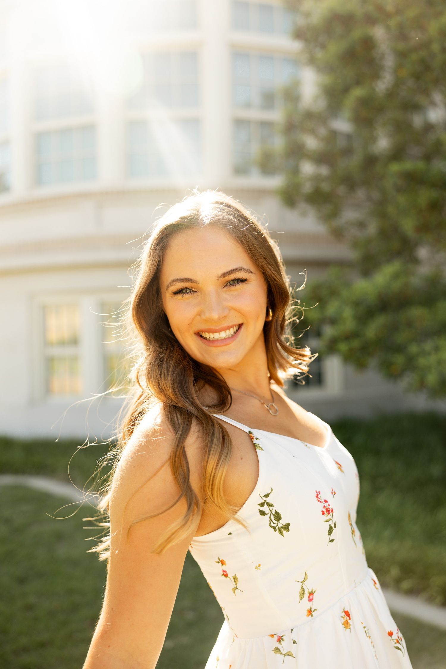 Sunny outdoor portraits with natural backlighting and joyful expressions.