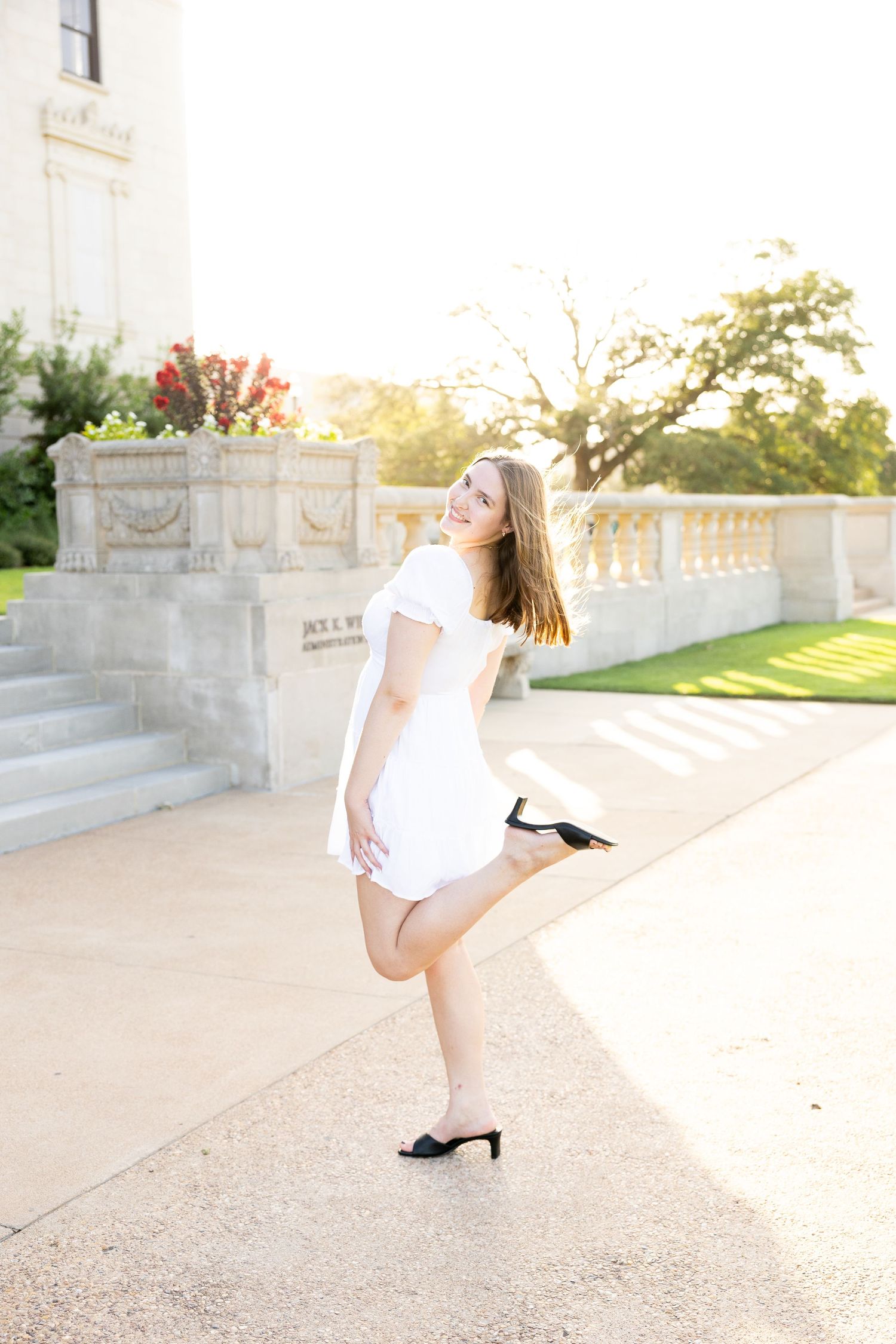Dynamic outdoor photo series with flowing movement against classic architecture.