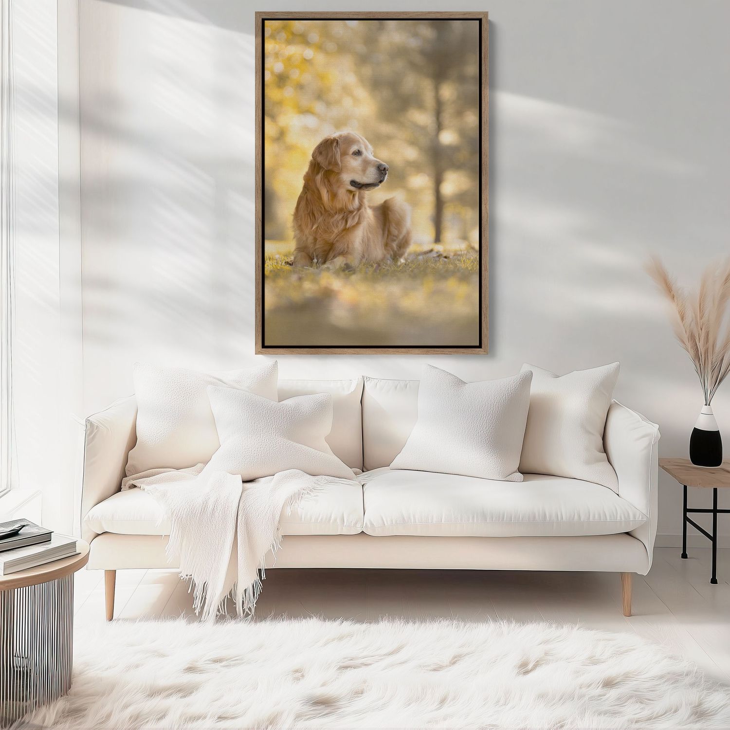 Golden retriever sitting peacefully in autumn setting with warm bokeh background and white couch decor.