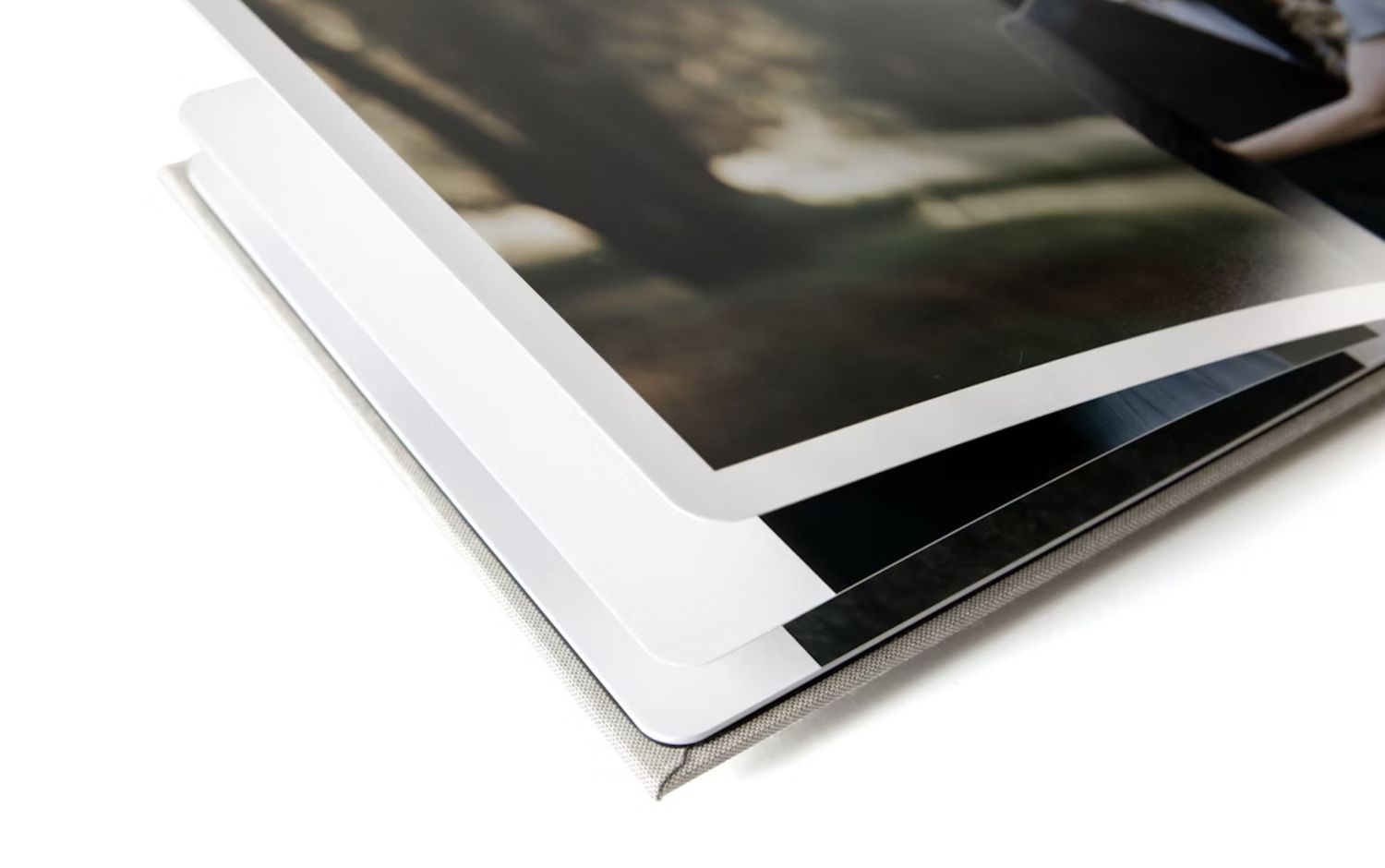 Detail of professional photo print corners showing layered white border construction.