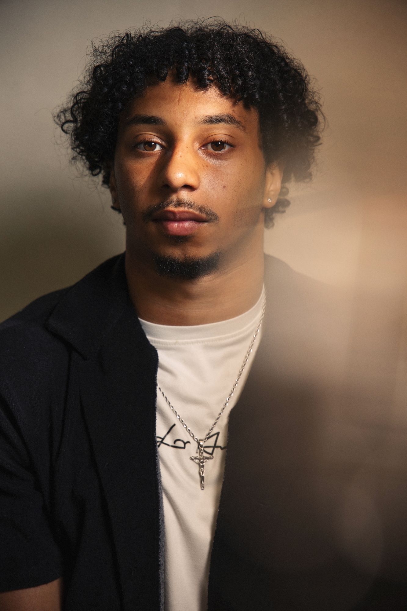 Portrait in moody studio lighting with creative blur.