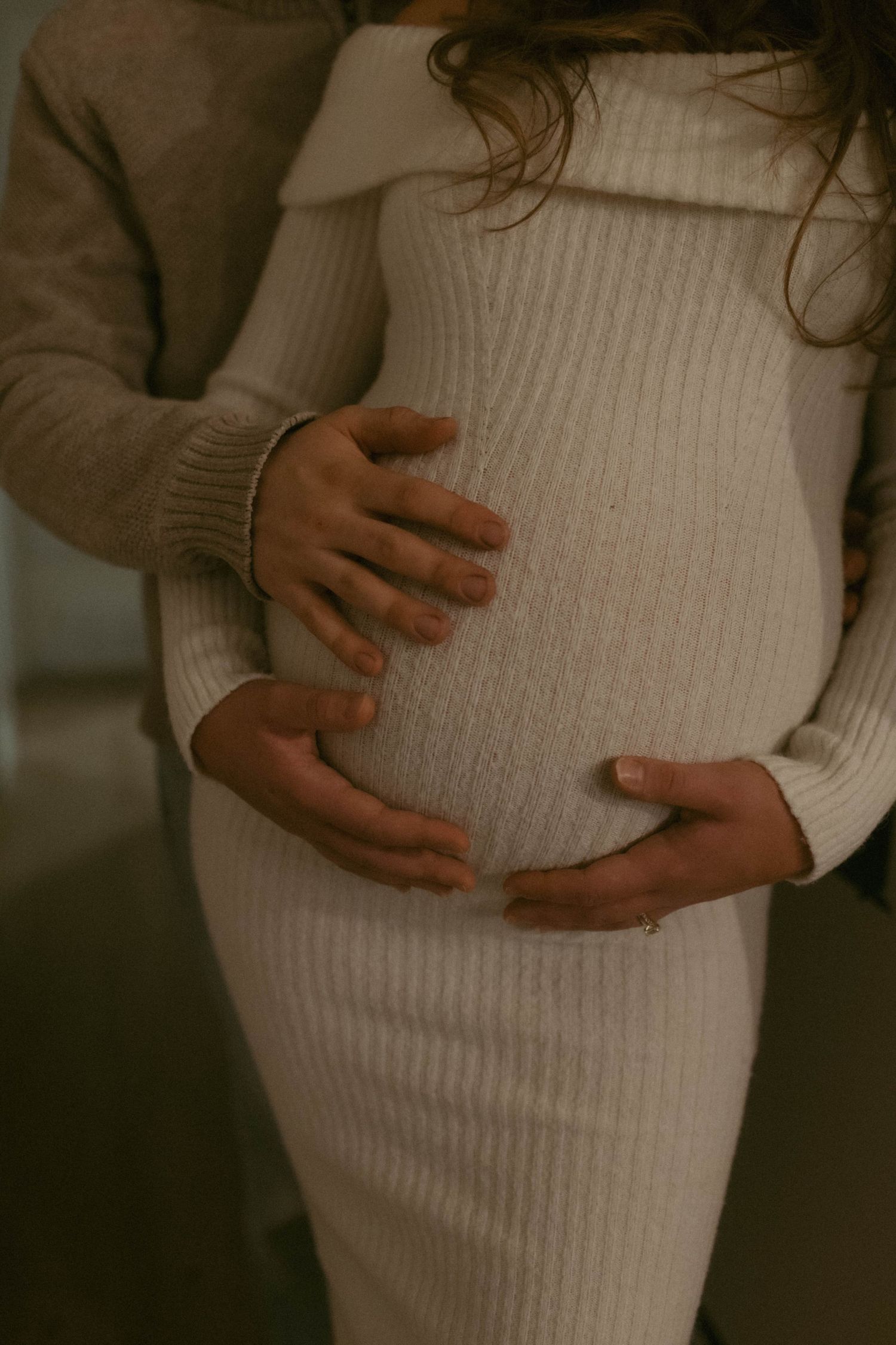 Maternity photography in Woodstock Ontario capturing natural connection, movement, and emotive moments for couples and growing families