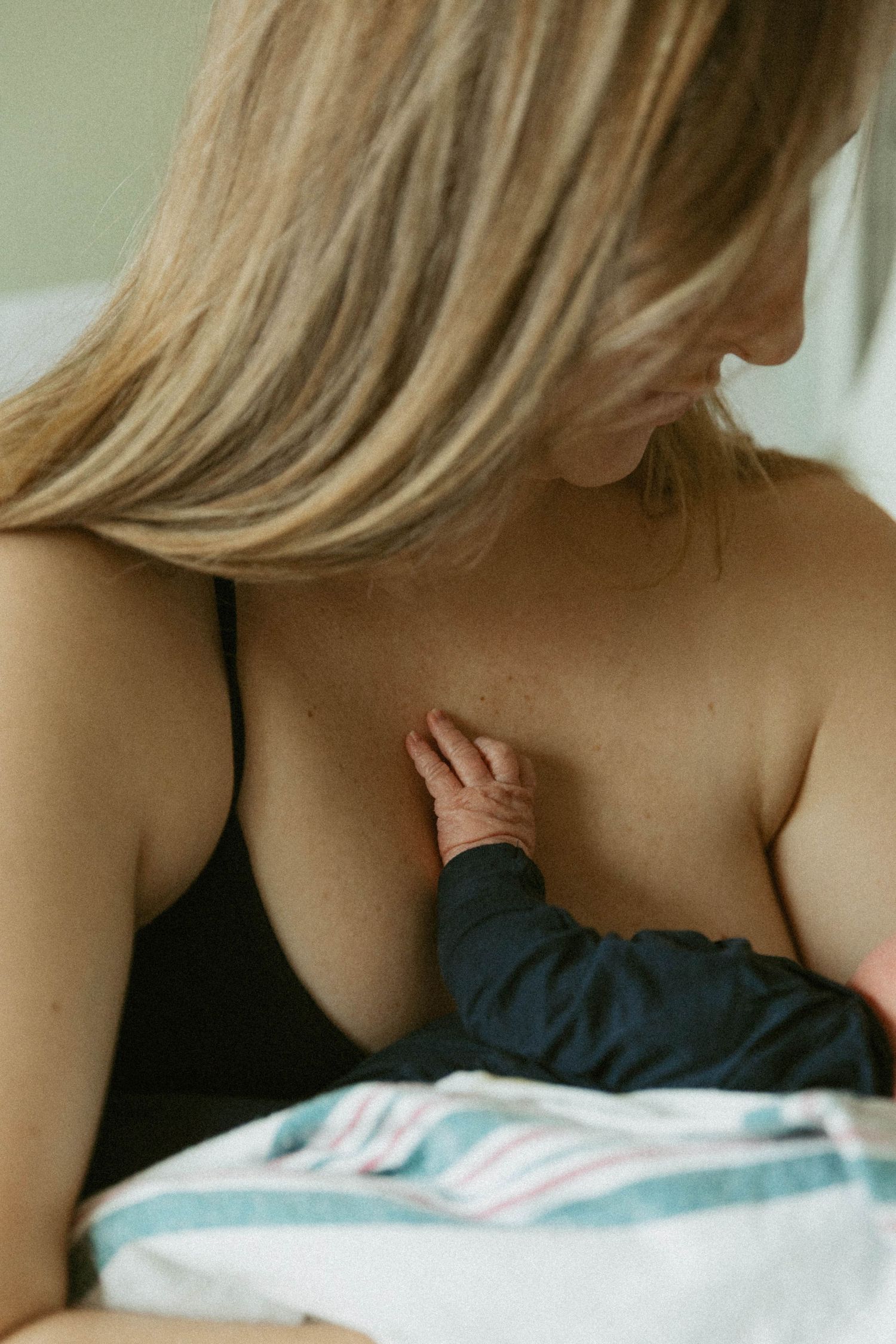 Hamilton Ontario Fresh 48 newborn photography capturing mother holding newborn in hospital