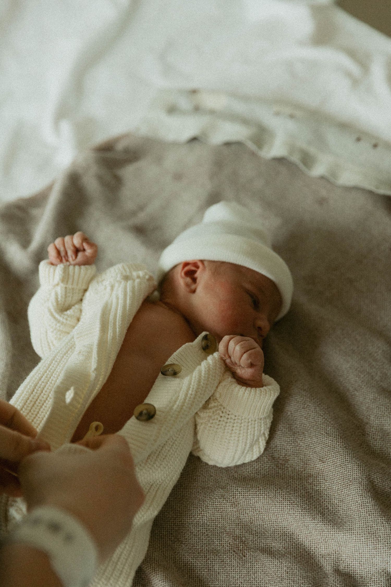 Hamilton Ontario Fresh 48 newborn photography capturing mother holding newborn in hospital
