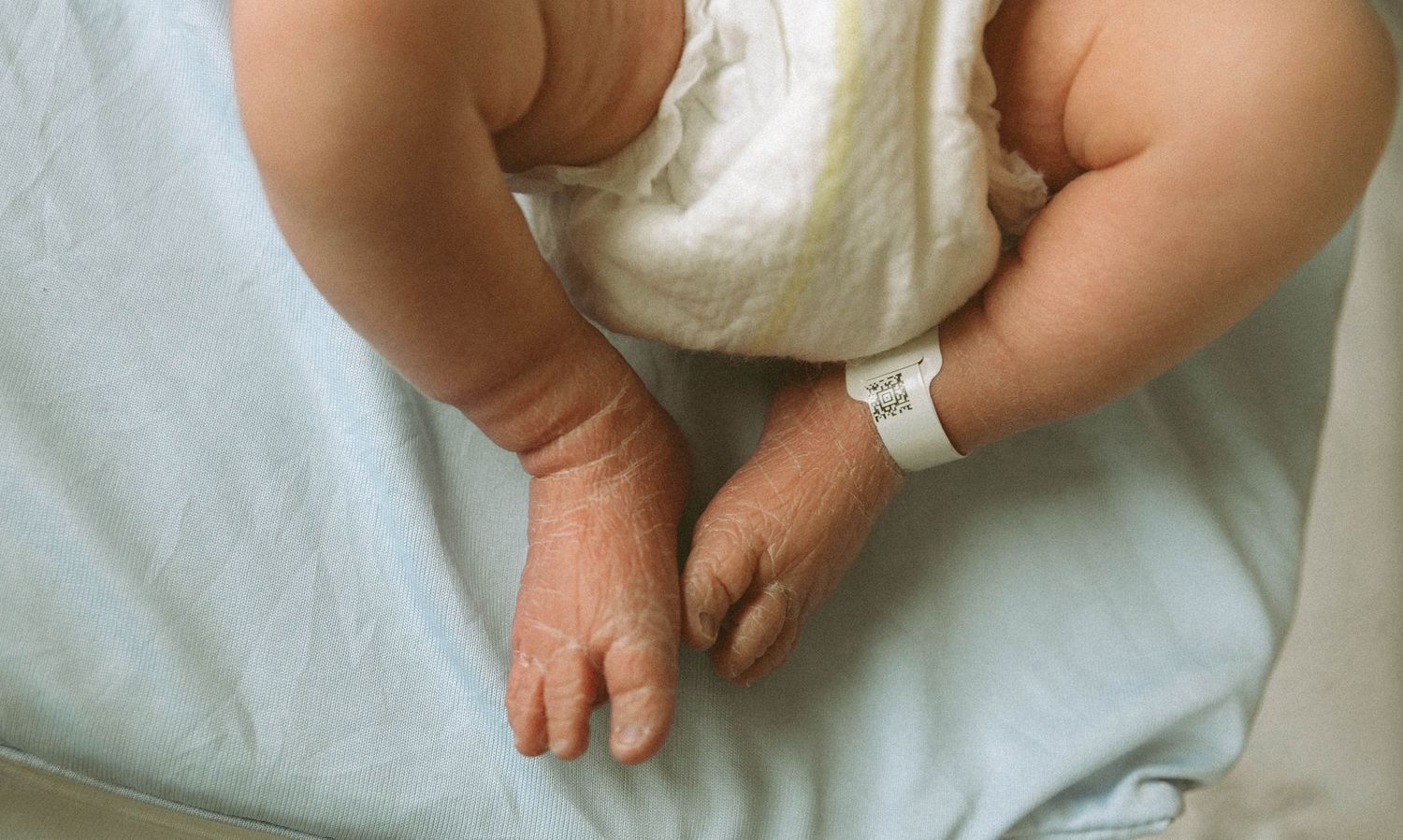 Toronto Fresh 48 newborn photography capturing mother and baby in hospital within first 24 hours after birth